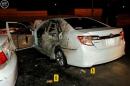 Damaged car is seen after a blast near the U.S. consulate in Saudi Arabia's second city of Jeddah