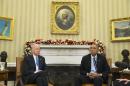 President Barack Obama, accompanied by Vice President Joe Biden, pauses while making a statement on Wednesday's mass shooting in San Bernardino, Calif., Thursday, Dec. 3, 2015, in the Oval Office of the White House in Washington. (AP Photo/Evan Vucci)