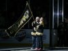 William and Patricia Campbell, parents of Krystle Campbell, who was killed in the Boston Marathon bombings, wave a "Boston Strong" banner before Game 4 in the Eastern Conference finals of the NHL hockey Stanley Cup playoffs between the Boston Bruins and the Pittsburgh Penguins, in Boston on Friday, June 7, 2013. (AP Photo/Elise Amendola)