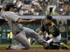 Pittsburgh Pirates catcher Russell Martin, right, tags out Detroit Tigers' Matt Tuiasosopo during the fifth inning of a baseball game in Pittsburgh, Thursday, May 30, 2013. (AP Photo/Gene J. Puskar)