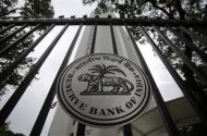 The Reserve Bank of India (RBI) seal is pictured on a gate outside the RBI headquarters in Mumbai July 30, 2013. REUTERS/Vivek Prakash/Files