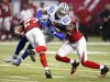 Cowboys' Witten gets hit by Falcons' McClain and Nicholas in the second half of their NFL football game in Atlanta