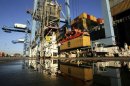Crews load and unload consumer products at the Port of New Orleans along the Mississippi River in New Orleans, Louisiana