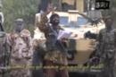 This image grab made on May 5, 2014 from a video obtained by AFP shows leader of Boko Haram Abubakar Shekau (C) delivering a speech