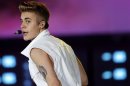 File photo of Canadian singer Justin Bieber performing on stage during a concert as part of his "Believe" World Tour in Dubai