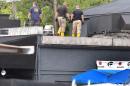 FBI lab personnel walk on the roof of the Pulse Nightclub Monday, June 20, 2016, investigating the mass shooting scene in Orlando. Federal investigators promised to provide more insight as to what was happening inside the Pulse nightclub after a gunman started a deadly assault that was the worst mass shooting in modern U.S. history. (Red Huber/Orlando Sentinel via AP)