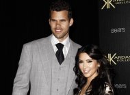 FILE - In this Aug. 17, 2011 file photo, reality TV personality Kim Kardashian, right, and her fiance, NBA basketball player Kris Humphries, arrive at the Kardashian Kollection launch party in Los Angeles. Kardashian's divorce attorney told a judge Friday, May 4, 2012, that she believes Humphries' hurt feelings about the marriage are slowing down the case and that it could get very expensive for the NBA player if he continues to pursue his claims the couple's nuptials were a fraud. Humphries filed for an annulment of the couple's 72-day marriage on Thursday in Los Angeles. (AP Photo/Matt Sayles, file)