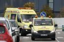 Two ambulances arrive at Madrid's Carlos III Hospital , carrying a possible new Ebola patient