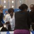 Job seekers speak to recruiters at a job fair sponsored by New York Department of Labor in New York