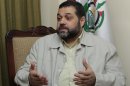 Osama Hamdan, who handles foreign relations for Hamas, speaks during an interview with The Associated Press, in the southern suburb of Beirut, Lebanon, on Wednesday May 2, 2012. Hamdan said the Islamic militant group has been holding secret political talks with five European Union member states in recent months. He also said that the talks with European government officials focus on the Hamas positions toward Israel and paralyzed Mideast peace efforts. (AP Photo/Hussein Malla)