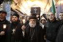 Christians take part in a symbolic funeral procession in Jerusalem's Old City on February 18, 2015, for the 21 Egyptian Coptic Christians beheaded by the Islamic State group in Libya