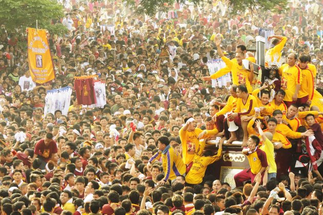 Seen at the annual Feast of the Black Nazarene during the procession from Quirino Grandstand, Metro Manila back to the Quiapo church on 09 January 2012. (Angela Galia/NPPA images)