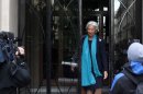 IMF Managing Director Christine Lagarde, leaves her apartment building before appearing in French court, in Paris, Thursday, May 23, 2013. Lagarde is being investigated by a special French court over a controversial arbitrage deal, which she oversaw as French Finance minister in 2008. (AP Photo/Thibault Camus)