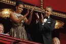 U.S. President Obama and first lady Michelle applaud as they attend the 2012 Kennedy Center Honors in Washington