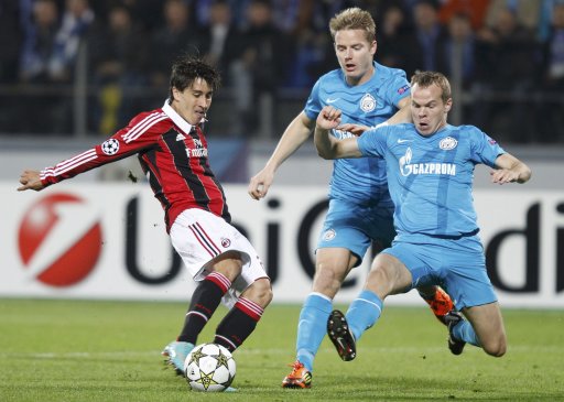 Zenit St. Petersburg's Anyukov and Hubocan fight for the ball with AC Milan's Krkic during their Champion's league Group C soccer match in St. Petersburg's Petrovsky Stadium