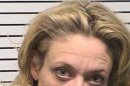This photo provided by Iredell County, NC, sheriffâ€™s department, Lisa Robin Kelly is shown. Kelly is free on bond after being arrested for assault. Police in the Charlotte, N.C., suburb of Mooresville arrested the 42-year-old Kelly and 61-year-old husband Robert Joseph Gilliam after responding to a disturbance at their home Monday, Nov. 26, 2012. Both are free on bond. Gilliam is charged with misdemeanor assault on a female. Kelly is charged with misdemeanor assault. They were taken to the Iredell County Detention Center and released on $500 bond apiece. They have a court date of Jan. 25. It's not known if either has an attorney. Kelly portrayed Laurie Forman, sister of Topher Grace's lead character Eric, on the FOX series, which ended in 2006. She also appeared on the TV shows "Murphy Brown" and "Married . . . With Children." (AP Photo/Iredell County, NC, sheriffâ€™s department)