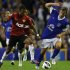 Manchester United's Nani pulls the shirt of Everton's Jelavic during their English Premier League soccer match in Liverpool