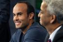 United States' Landon Donovan, left, speaks about his retirement from soccer as Sunil Gulati, president of the United States Soccer Federation, listens during a press conference in Bristol, Conn. Friday, Oct. 10, 2014. Donovan makes his last international appearance Friday night in a soccer exhibition against Ecuador. (AP Photo/Elise Amendola)