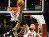 Chicago Bulls power forward Taj Gibson (22) challenges a shot by Sacramento Kings point guard Tyreke Evans (13) during the second half of an NBA basketball game, Wednesday, Oct. 31, 2012, in Chicago. The Bulls won 93-87. (AP Photo/Charles Rex Arbogast)