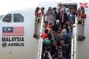 Syrian migrants arrive at Subang Air Force base in Subang, outside Kuala Lumpur on May 28, 2016
