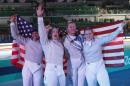 United States Women Fecing team celebrates after defeating Italy during the Bronze medal compertition in the women's team sabre fencing competition at the 2016 Summer Olympics in Rio de Janeiro, Brazil, Saturday, Aug. 13, 2016. (AP Photo/Vincent Thian)