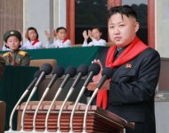 This photo released by North Korea's official Korean Central News Agency (KCNA) on June 7 shows North Korean leader Kim Jong-Un (C) making a speech on June 6. South Korea accused North Korea of "crossing the line" with its recent threats and insults, and pressed the impoverished country to start repayments for past food aid