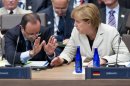 Hollande y Merkel, en la última cumbre de la OTAN