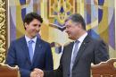 Ukraine's Petro Poroshenko (right) and Canada's Justin Trudeau shake hands after their meeting in Kiev, on June 11, 2016