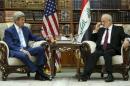 Jaafari receives Kerry in the library at the foreign minister's villa in Baghdad