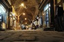 File photo of people walking through Al-Madina Souq market in Aleppo