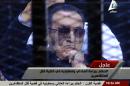 In this image made from video broadcast on Sada el-Balad via Egypt's State Television, ousted Egyptian President Hosni Mubarak sits in the defendant cage during his trial at a court in Cairo, Egypt, Saturday, Nov. 29. Egypt court dismissed criminal charges against Mubarak in the killing of more than 900 protesters during the 2011 uprising against his rule. (AP Photo/Sada el-Balad via Egypt's State Television)