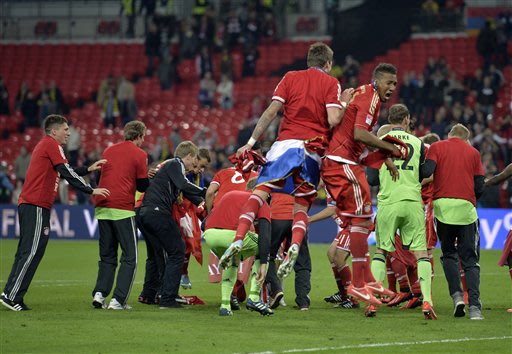 Bayern Munich players react, after winning the Champions League Final soccer match against Borussia Dortmund, at Wembley Stadium in London, Saturday, May 25, 2013
