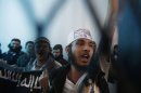 Defendants linked to al Qaeda react as a verdict upholding their jail sentences is pronounced in Yemen in April. Renewed al Qaeda threats have led to the closure of nearly two dozen U.S. embassies.
