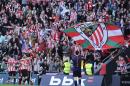 Athletic Bilbao's team celebrates after scoring a goal against Real Madrid, during their La Liga soccer match, at San Mames stadium in Bilbao, northern Spain, Saturday, March 7, 2015. (AP Photo/Alvaro Barrientos)
