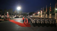 U.S. President Barack Obama, right on red carpet, and Thai Prime Minister Yingluck Shinawatra, left on red carpet, attend the arrival ceremony at Thai Government House in Bangkok, Thailand, Sunday, Nov. 18, 2012. (AP Photo/Pablo Martinez Monsivais)