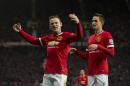 Manchester United's Wayne Rooney, left, celebrates with teammate Adnan Januzaj after scoring his second goal during the English Premier League soccer match between Manchester United and Sunderland at Old Trafford Stadium, Manchester, England, Saturday Feb. 28, 2015. (AP Photo/Jon Super)