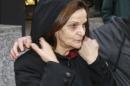 FILE - In this Oct. 22, 2013 file photo, Rasmieh Yousef Odeh leaves the federal courthouse in Chicago after her initial appearance on charges of allegedly lying about her conviction for a deadly bombing more than 40 years ago in Israel. Odeh had been convicted of an attack that killed two people at a Jerusalem market in 1969. She might plead guilty in Detroit on Wednesday, May 21, 2014, to failing to tell U.S. immigration officials about her conviction, according to her lawyer. (AP Photo/Charles Rex Arbogast, File)