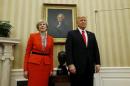 British Prime Minister Theresa May and President Trump stand side by side at start of Oval Office meeting at the White House in Washington