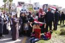 Supporters of Syrian President Bashar al-Assad attend a rally to support him and the army, at the coastal city of Jableh in Lattakia