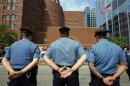 MIT police officers stand outside the federal courthouse for the court appearance by accused Boston Marathon bomber Dzhokhar Tsarnaev in Boston