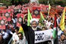 An Iranian cleric holding an anti-Israeli placard chants slogan, while attending an annual pro-Palestinian rally marking Al-Quds (Jerusalem) Day in Tehran, Iran, Friday, Aug. 2, 2013. The last Friday of the Islamic holy month of Ramadan is observed in many Muslim countries as Al-Quds day, as a way of expressing support to the Palestinians and emphasizing the importance of Jerusalem to Muslims. (AP Photo/Ebrahim Noroozi)