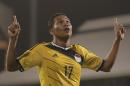 Colombia's Carlos Bacca, celebrates after scoring against USA, during an international friendly soccer match at the Craven Cottage ground in London, Friday, Nov. 14, 2014. (AP Photo/Lefteris Pitarakis)