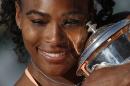 FILE - In this June 6, 2015, file photo, Serena Williams, of the United States, holds the trophy after winning the final of the French Open tennis tournament against Lucie Safarova, of the Czech Republic, at the Roland Garros stadium, in Paris. For the fourth time, Williams has been named The Associated Press Female Athlete of the Year. (AP Photo/Michel Euler, File)