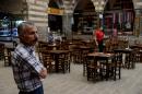 An empty cafe awaits customers on October 1, 2015, at the once-bustling Hasan Pasa caravansary in the southeastern Turkish city of Diyarbakir, which has seen tourists and shoppers evaporate amid fresh violence in the Kurdish conflict