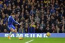 Chelsea's Belgian midfielder Eden Hazard shoots to score the opening goal of the English Premier League football match between Chelsea and Tottenham Hotspur at Stamford Bridge in London on December 3, 2014