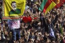 Some thousands of supporters demonstrate waving various PKK flags and images of jailed Kurdish rebel leader Abdullah Ocalan, in southeastern Turkish city of Diyarbakir, Turkey, Thursday, March 21, 2013. Ocalan called Thursday for an immediate cease-fire and for thousands of his fighters to withdraw from Turkish territory, a major step toward ending the fighting for self-rule for Kurds in southeastern Turkey, one of the world's bloodiest insurgencies lasting nearly 30-years and costing tens of thousands of lives.(AP Photo)