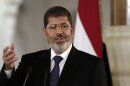 In this July 13, 2012 file photo, Egyptian President Mohammed Morsi speaks to reporters at the Presidential palace in Cairo. President Barack Obama begins his second term straining to maintain a good relationship with Egypt, an important U.S. ally whose president is a conservative Islamist walking a fine line between acting as a moderate peace broker and keeping his Muslim Brotherhood party happy with anti-American rhetoric. The White House last summer had hoped to smooth over some of the traditional tensions between Washington and the Brotherhood, a party rooted in opposition to Israel and the U.S., when Egypt overthrew dictator Hosni Mubarak and picked Morsi as its first democratically-elected leader. (AP Photo/Maya Alleruzzo, File)