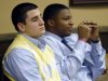Trent Mays, 17, left, and co-defendant 16-year-old Ma'lik Richmond sit at the defense table during a recess  of their trial on rape charges in juvenile court on Thursday, March 14, 2013, in Steubenville, Ohio. Mays and Richmond are accused of raping a 16-year-old West Virginia girl in August of 2012. (AP Photo/Keith Srakocic, Pool)