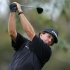 U.S. golfer Phil Mickelson hits off the 11th tee of the north course at Torrey Pines during first round play at the Farmers Insurance Open in San Diego, California January 24, 2013.