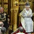Britain's Queen Elizabeth delivers her speech during the State Opening of Parliament at the House of Lords, alongside Prince Charles in London Wednesday May 8, 2013.  The State Opening of Parliament marks the formal start of the parliamentary year, the Queen delivered a speech which set out the government's agenda for the coming year. (AP Photo/Toby Melville, Pool)